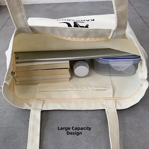 Interior view of large white canvas tote bag showing zipper pocket and spacious capacity