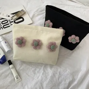 Floral canvas makeup bag with 3D pink felt flower charms in cream and black color