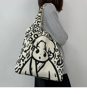 Detail view of large canvas tote bag featuring black and white hand-drawn manga portrait art
