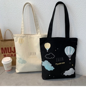 Detailed close-up of the screen-printed hot air balloon design on a canvas tote bag
