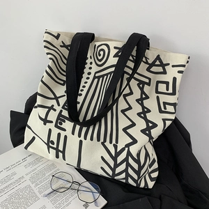 Large capacity canvas tote bag with black and white abstract tribal pattern for daily use