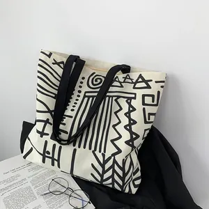 Detail view of double-sided abstract geometric prints on a thick canvas tote bag