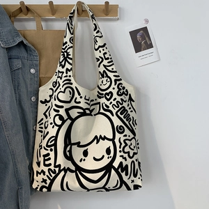 Artistic cream canvas tote bag with black hand-drawn graffiti and girl portrait