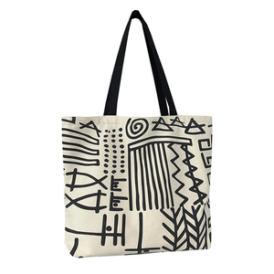 Minimalist canvas tote bag with black abstract geometric print and fabric straps