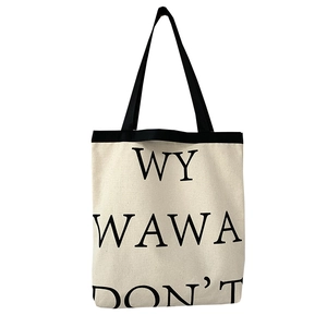 Minimalist canvas tote bag with black letter print and durable handles for school or travel