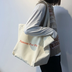 Sac fourre-tout en toile blanche avec lettrage orange Famous For Piz pour le voyage