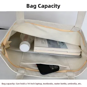 Spacious beige canvas tote interior fitting a 14-inch laptop and daily essentials