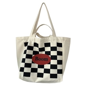 Large checkerboard canvas tote bag with red Boom patch and dual shoulder handles