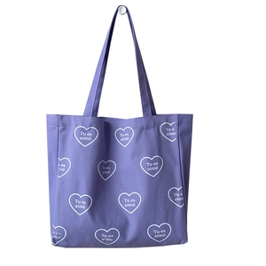 Grand sac cabas violet en toile avec imprimés coeurs blancs et texte Tu es aimé