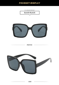 Detail of square oversized sunglasses featuring chic quilted texture on the black temples