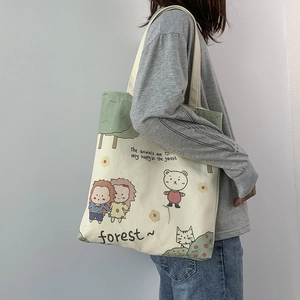 Detailed side view of a minimalist canvas tote bag with forest cartoon illustration