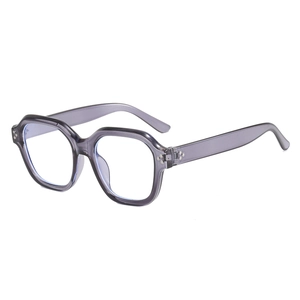 Monture de lunettes hexagonale oversize en violet transparent avec rivets en métal