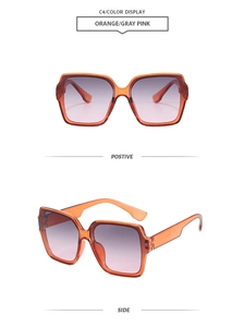 Detail view of square orange frames and grey pink gradient lenses on fashion sunglasses