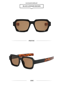 Detail view of square black sunglasses with brown lenses and leopard print side arms