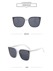 Detail of square white frame sunglasses with black lenses and gold hinge accents