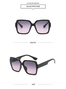 Detail of square oversized black frame sunglasses with gradient purple pink lenses