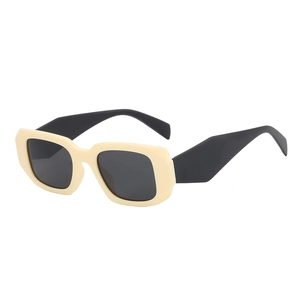Lunettes de soleil rétro rectangulaires à monture crème et branches noires pour le style