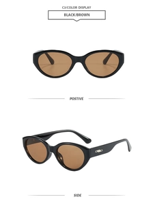 Details einer Vintage-Cat-Eye-Sonnenbrille mit schwarzem Rahmen und Silberverzierung