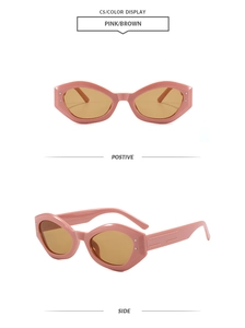 Detail view of pink cat-eye sunglasses with brown lenses and metal rivet accents