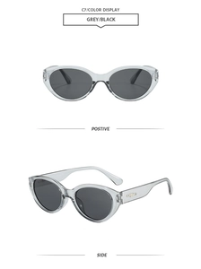 Detailansicht der Cat-Eye-Sonnenbrille mit grauem Rahmen und schwarzen Gläsern