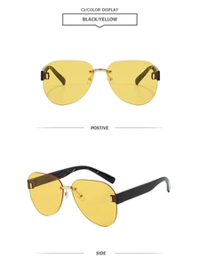 Detail view of rimless aviator sunglasses with yellow lenses and gold metal bridge