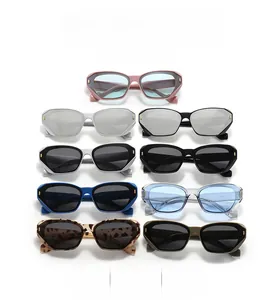 Detail of colorful geometric cat-eye sunglasses with golden metal hinges and UV protection