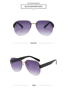 Detail view of rimless aviator sunglasses with gradient lenses and gold metal hinges