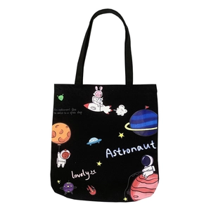 Black canvas tote bag with colorful astronaut and space theme print on white background
