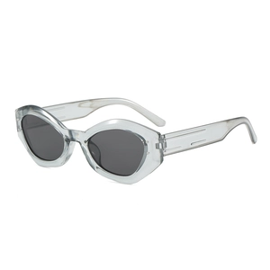 Modern cat-eye sunglasses with grey translucent frame and dark UV400 lenses