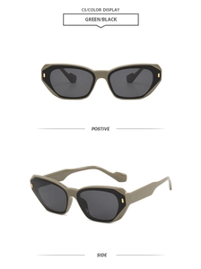 Detail view of olive green square sunglasses with gold metal hinges and grey lenses
