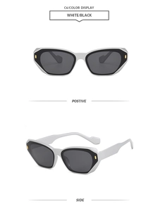 Detail view of square cat-eye sunglasses with white frames and gold geometric accents