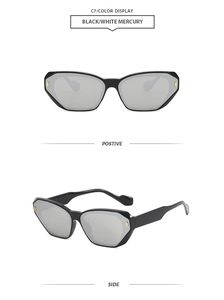 Detail view of square black sunglasses with silver mercury lenses and gold metal accents
