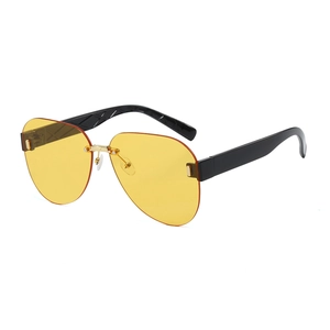 Fashionable rimless pilot sunglasses with yellow lenses and diamond-patterned black temples