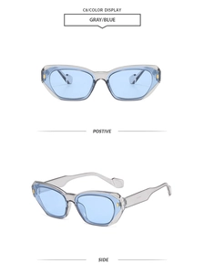 Detail view of square cat-eye sunglasses with grey resin frame and light blue lenses