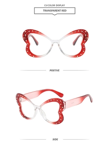 Dettaglio montatura a farfalla rosso trasparente con decorazioni in strass