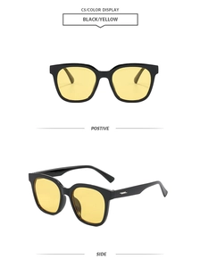 Detailansicht der quadratischen schwarzen Sonnenbrille mit gelben Gläsern und Metalldetails