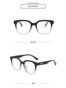 Detail of classic square oversized frames with black and white gradient finish and metal accents