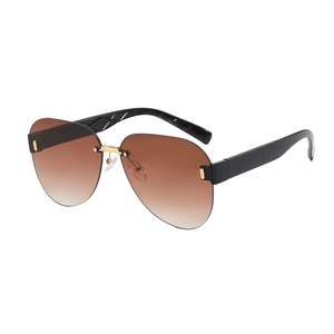 Retro rimless pilot sunglasses with brown gradient lenses and wide black temples