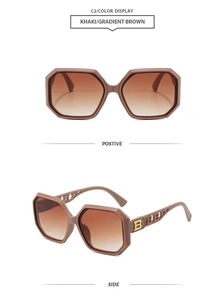 Detail of khaki polygon sunglasses with gradient lenses and golden letter decoration