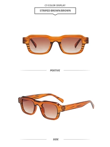 Detail der gestreiften braunen Azetat-Sonnenbrille und Verlaufsgläser in der Nahaufnahme
