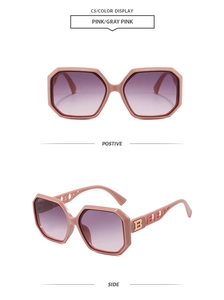 Detail of pink geometric sunglasses with golden B letter logo on hollow temples