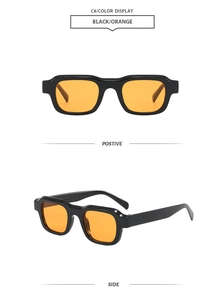 Klassische quadratische Sonnenbrille mit dickem schwarzem Rahmen und orangefarbenen Gläsern