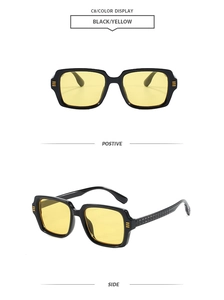 Lunettes de soleil carrées rétro avec monture noire, verres jaunes et rayures latérales