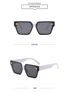 Detail of square sunglasses featuring white temples and gold metal letter G accents