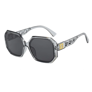 Chic oversized octagonal sunglasses in transparent grey with golden B-logo temple detail