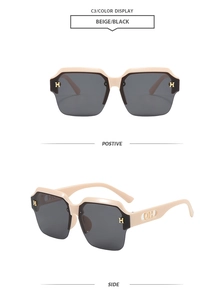 Detail view of beige square semi-rimless sunglasses with gold H logo and dark gray lenses