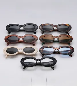 Multiple color options for retro oval sunglasses featuring stylish metallic stud details