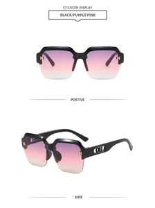 Detail of black semi-rimless sunglasses with purple-pink gradient lenses and gold H-buckles