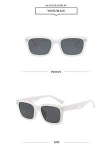 Detail view of white square sunglasses showing metallic stripe accents and side cutout