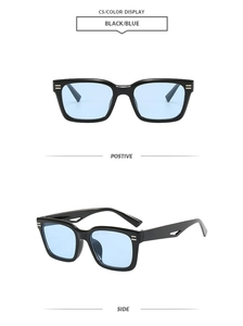Detail view of retro square black sunglasses with light blue lenses and silver metal hinges